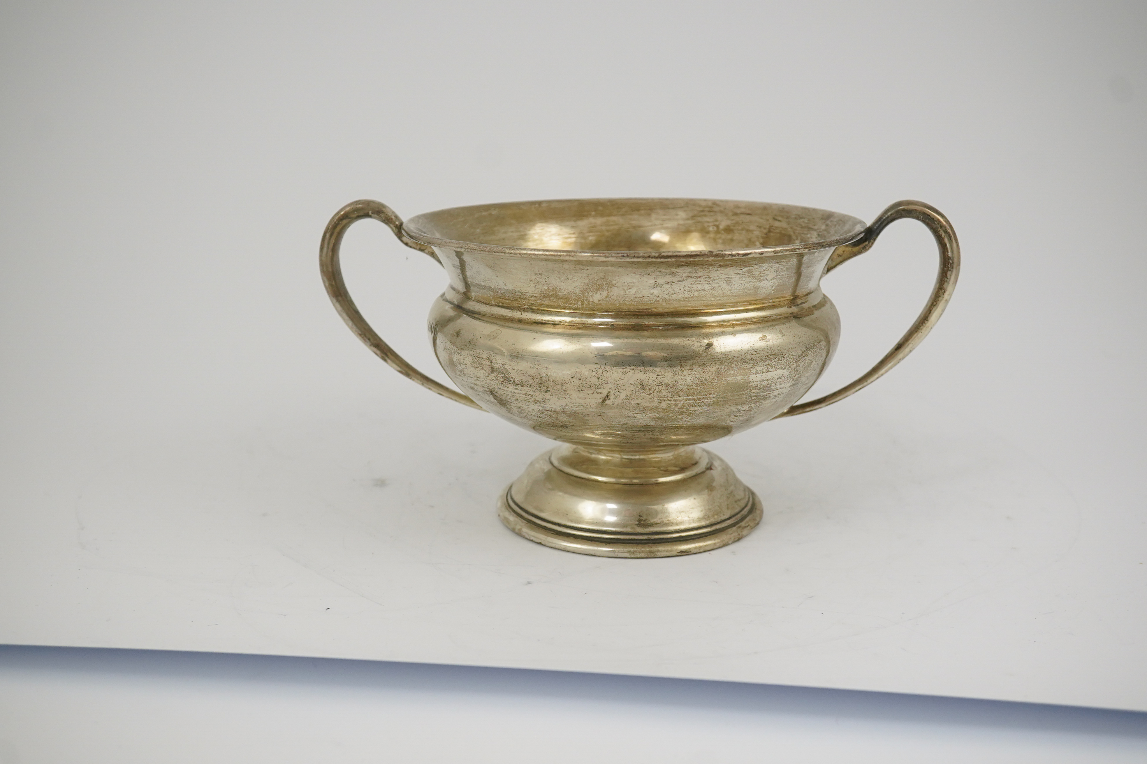 A George V silver two handled pedestal bowl, by Charles Edwards